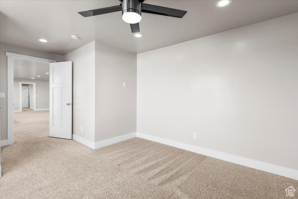 Spare room featuring light carpet, recessed lighting, and ceiling fan