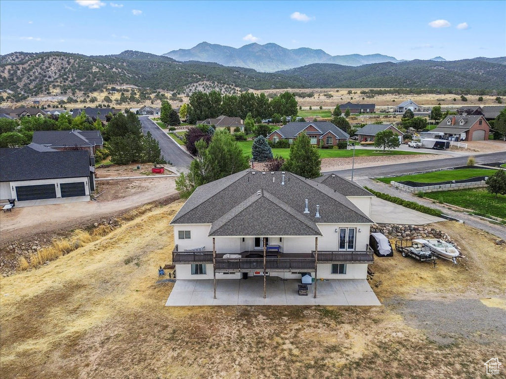 Aerial perspective of suburban area with a mountain backdrop