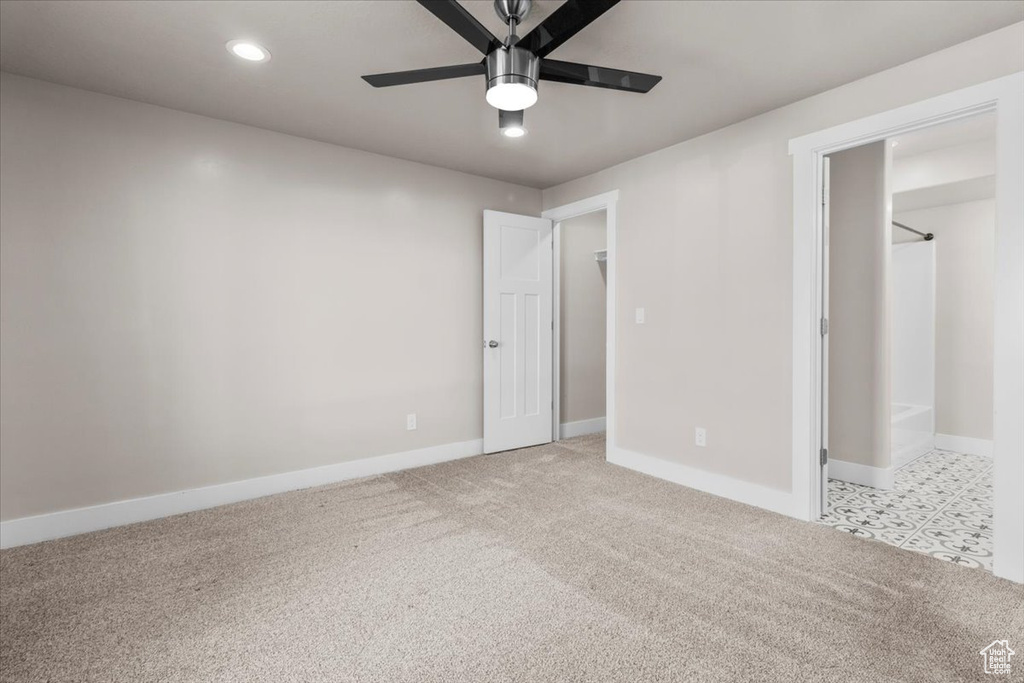 Unfurnished bedroom with light colored carpet, recessed lighting, and a ceiling fan