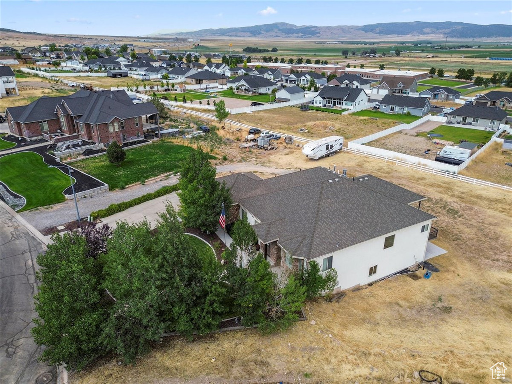 Aerial perspective of suburban area with a mountainous background