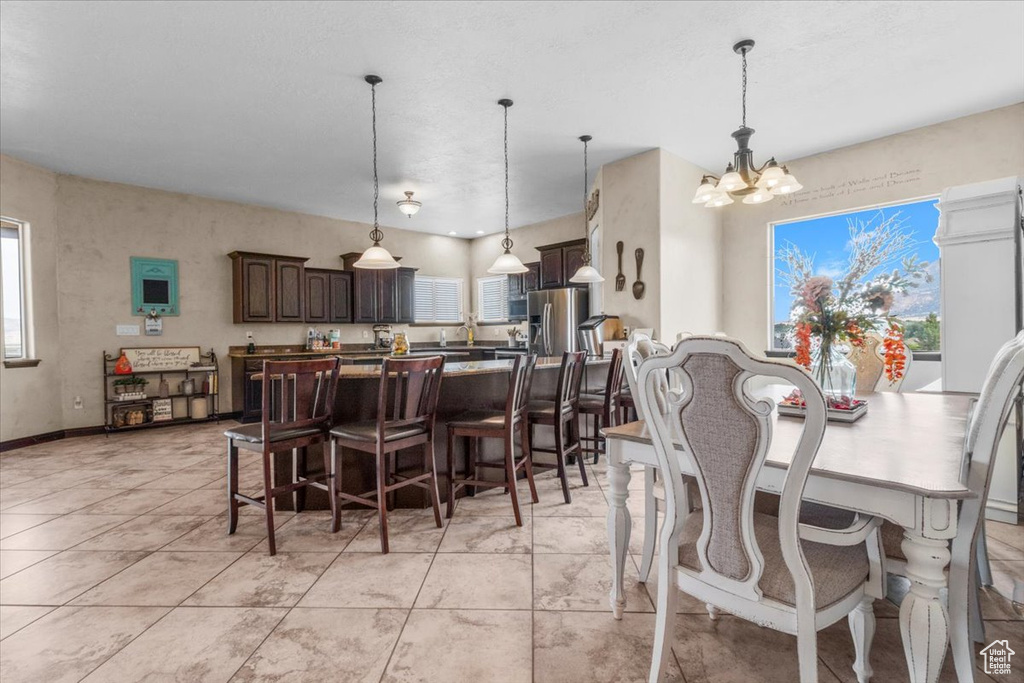 Dining area featuring a chandelier and healthy amount of natural light