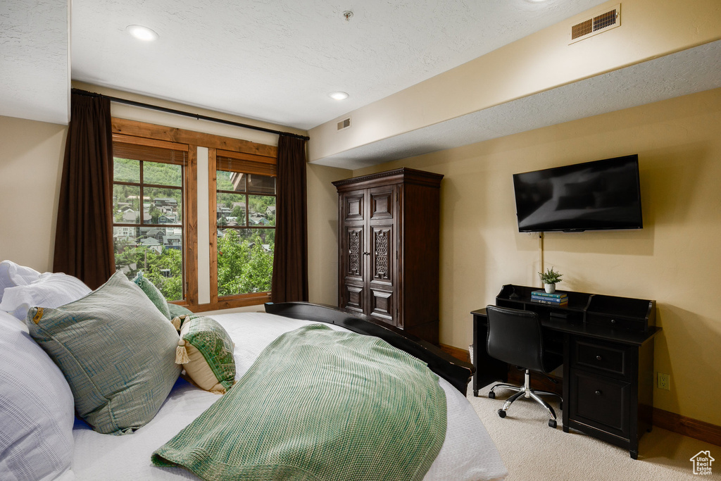 Bedroom with recessed lighting, a desk, and carpet flooring