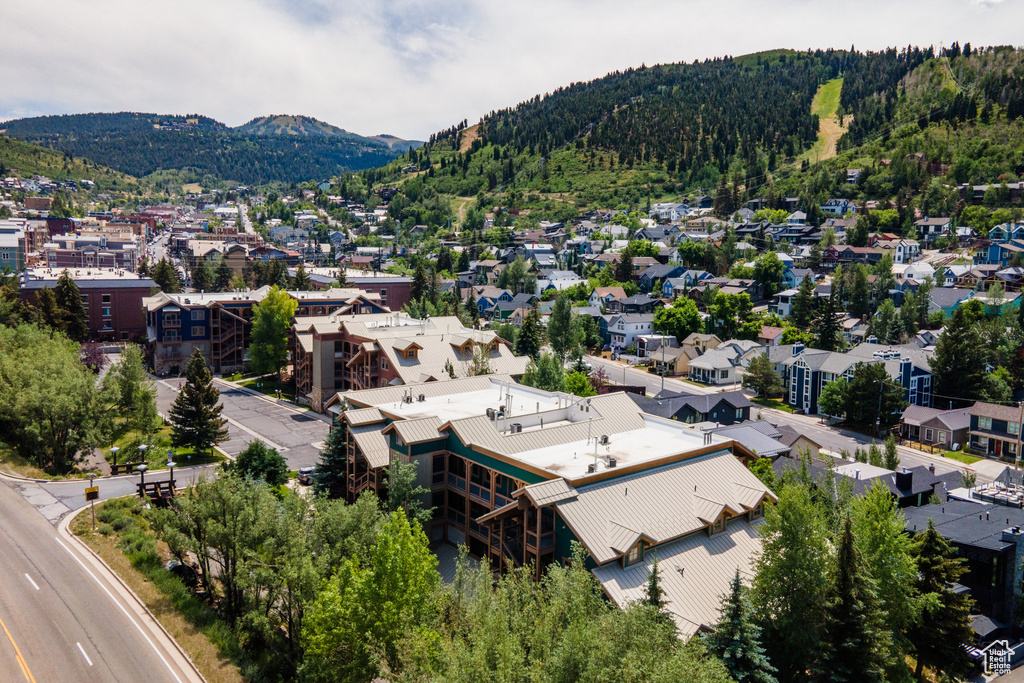 Aerial view of residential area featuring a mountainous background
