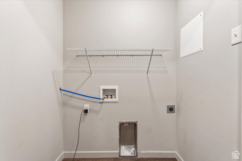 Laundry area featuring hookup for a washing machine and hookup for an electric dryer