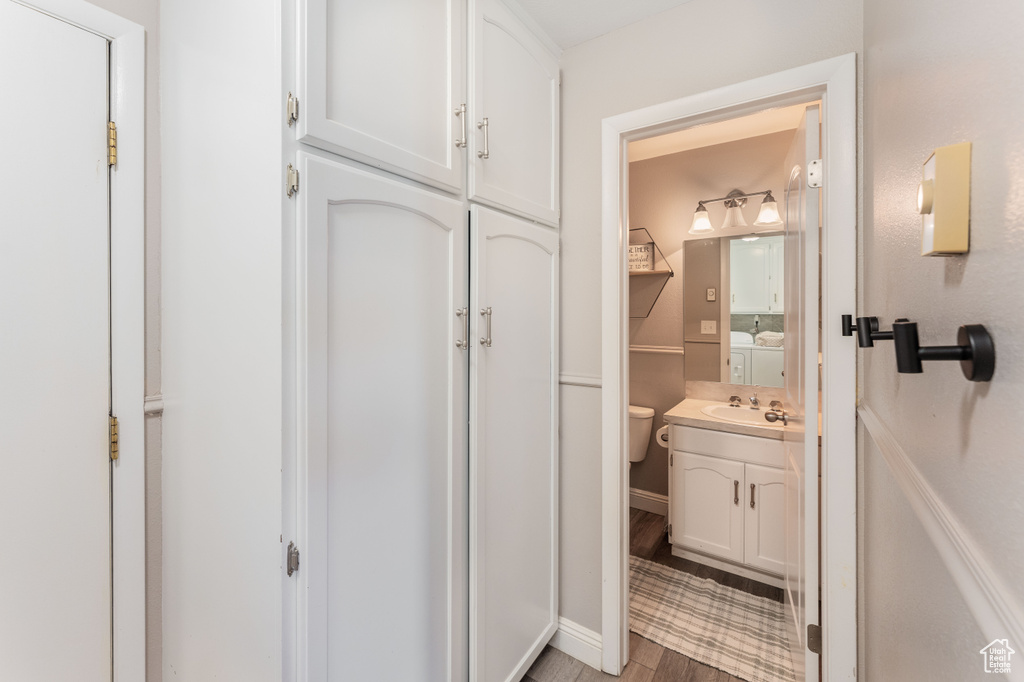 Bathroom with vanity and wood finished floors