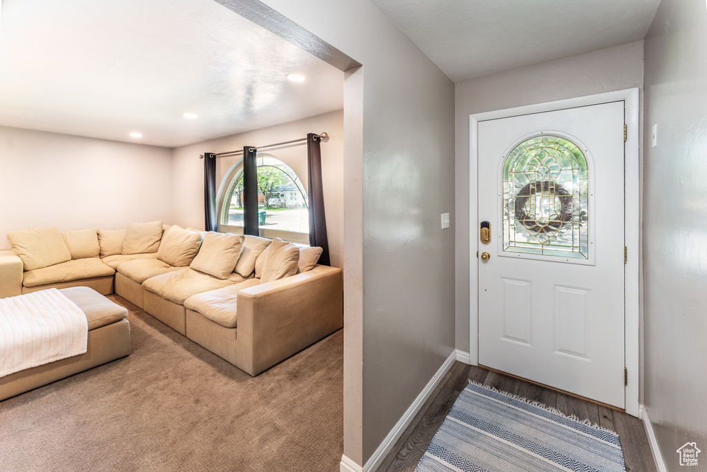 Entrance foyer featuring baseboards and recessed lighting