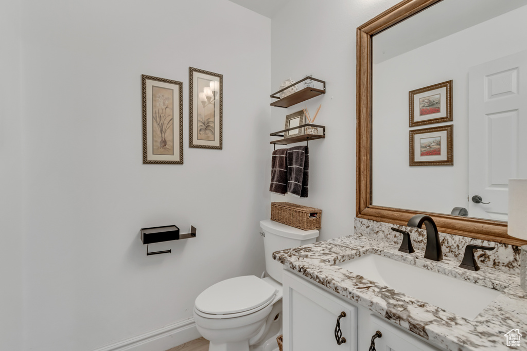 Bathroom featuring vanity and toilet