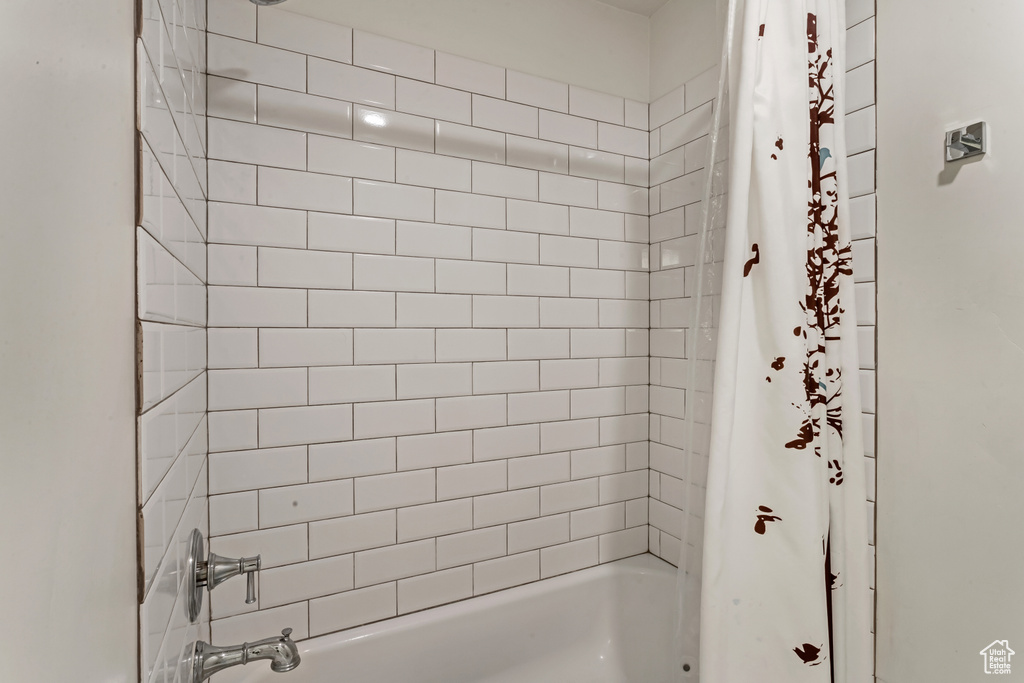 Full bath featuring shower / tub combo