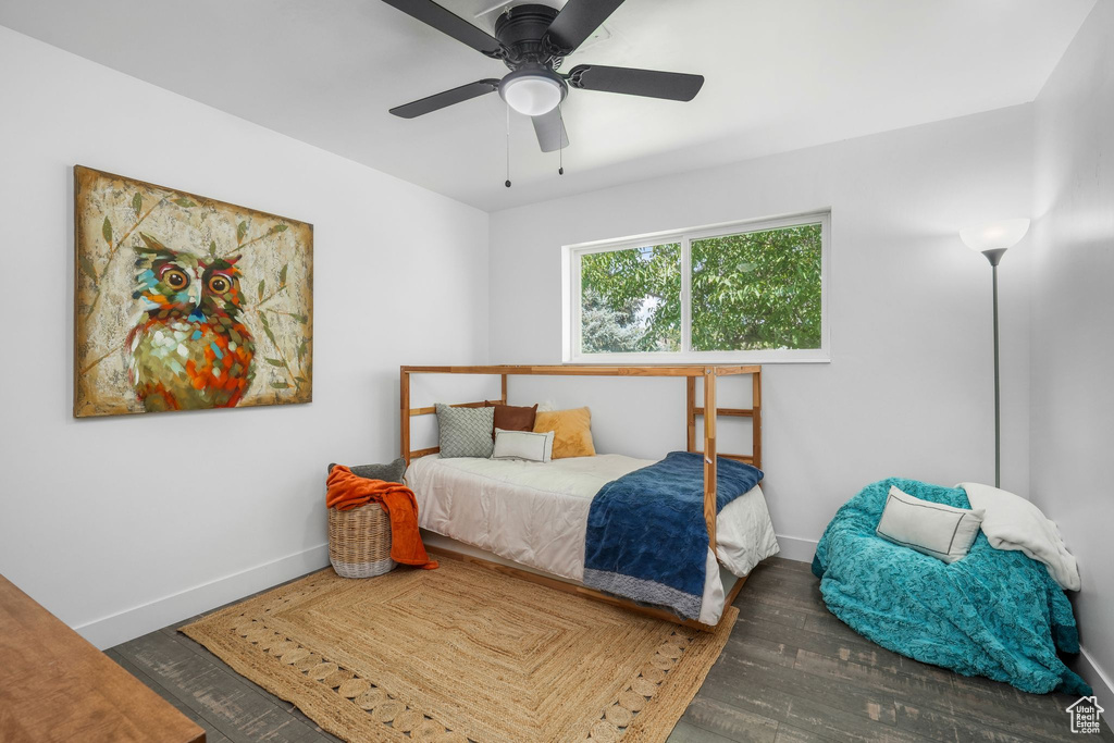 Bedroom with wood finished floors and ceiling fan
