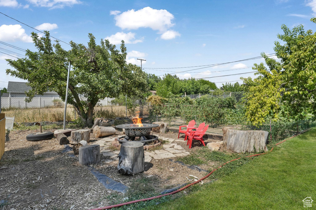 View of yard featuring a fire pit