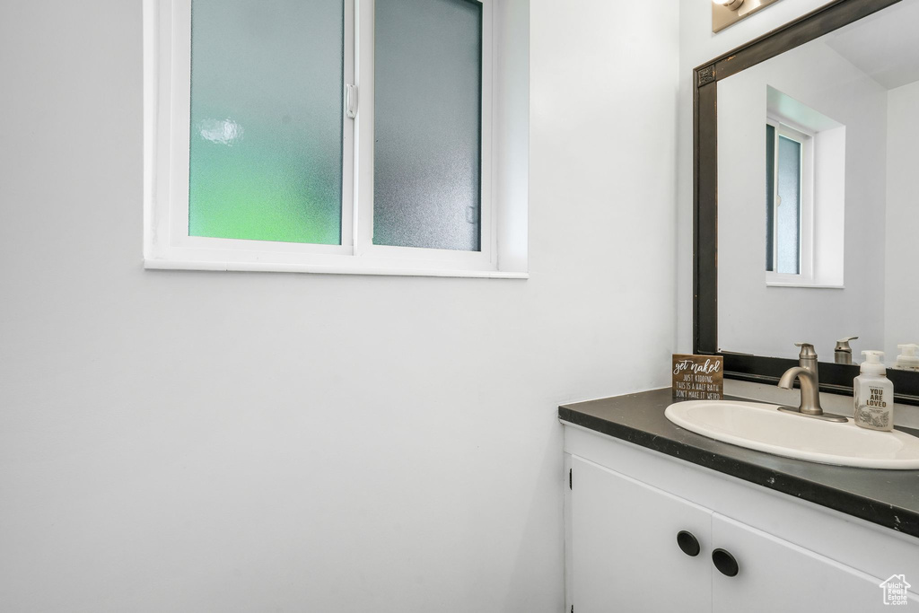 Bathroom with vanity and healthy amount of natural light