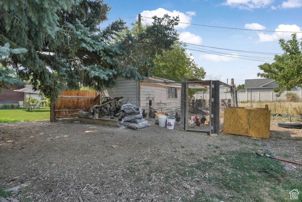 View of yard with exterior structure and an outdoor structure