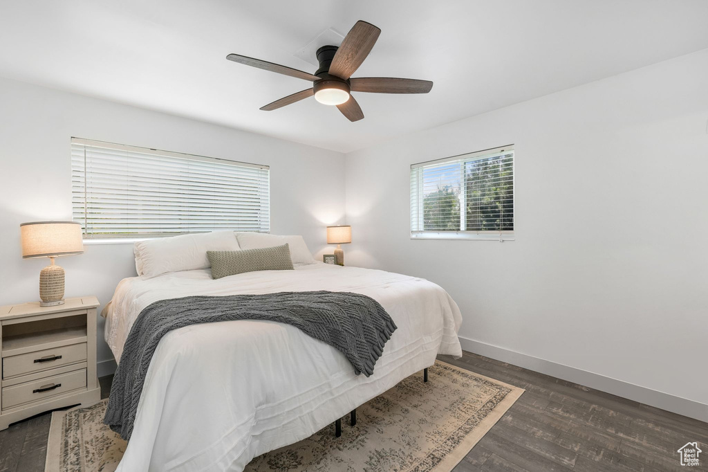 Bedroom featuring wood finished floors and a ceiling fan