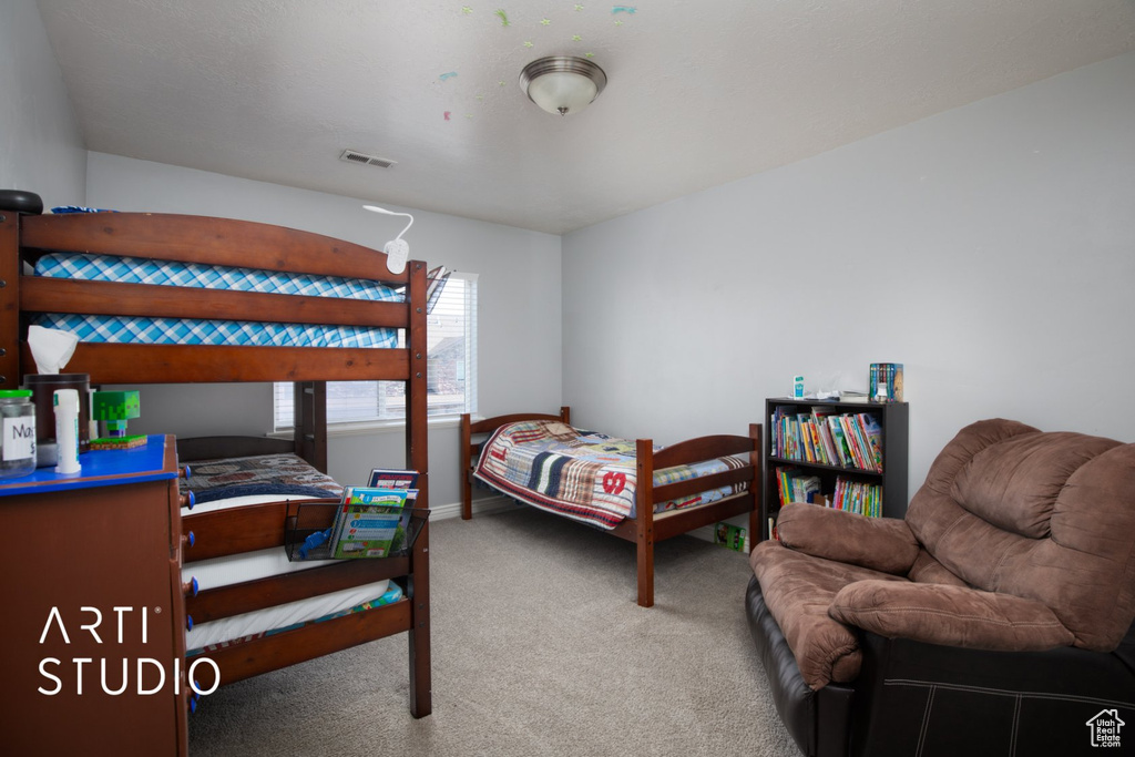 Bedroom with carpet and baseboards