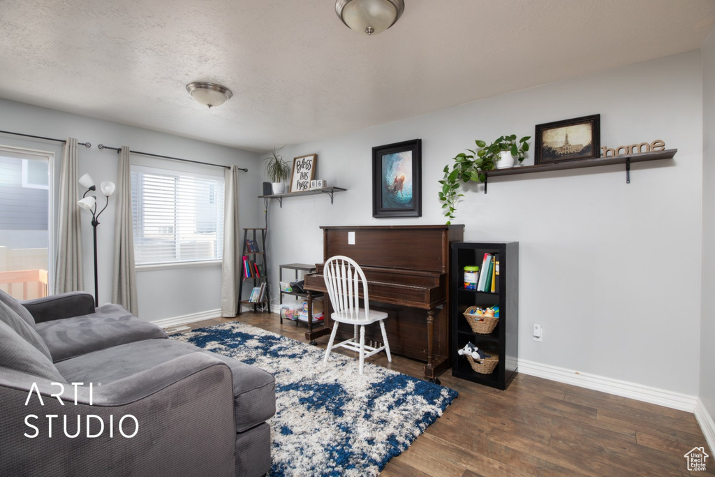Living room featuring baseboards and wood finished floors