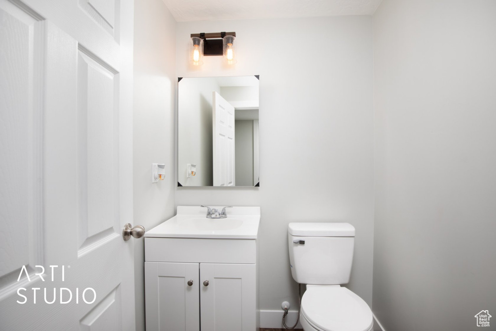 Half bath with vanity and toilet