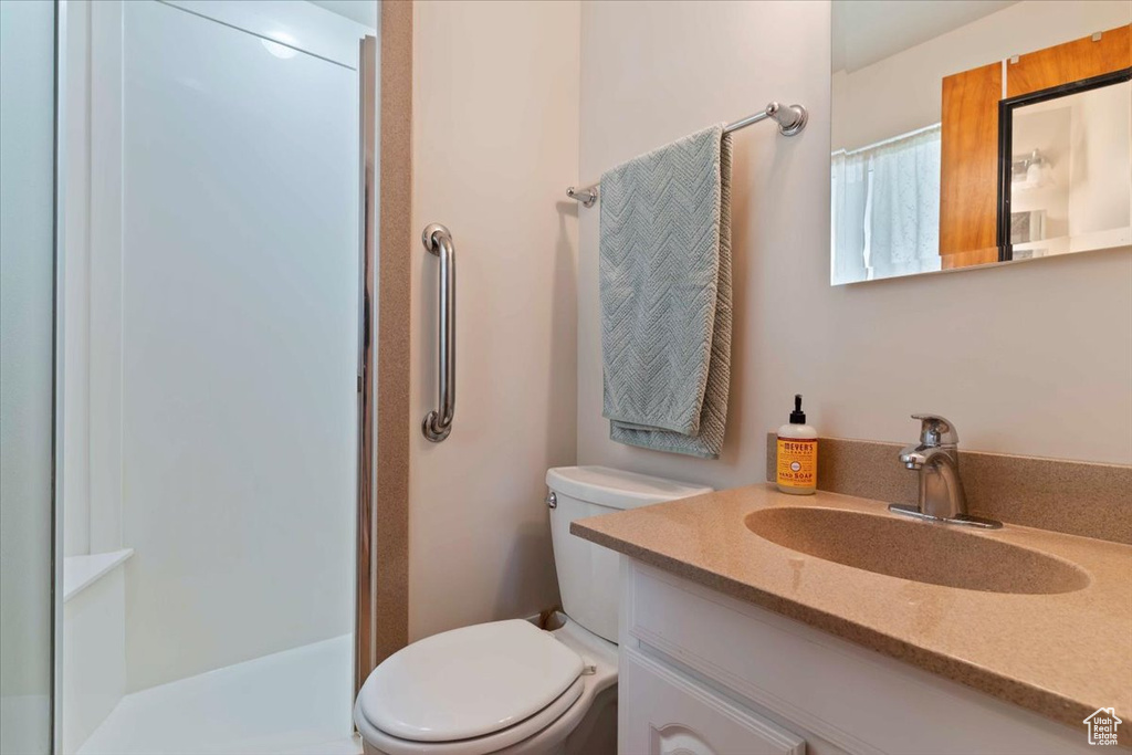 Full bath featuring vanity and a shower with curtain