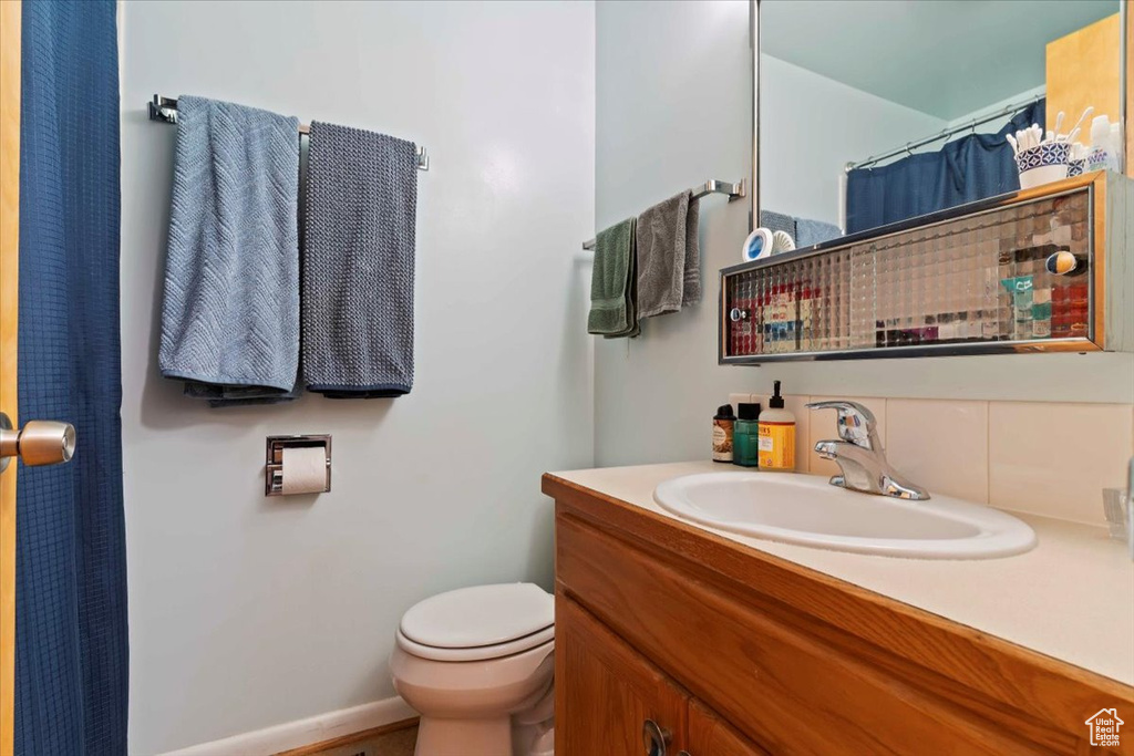 Full bathroom featuring vanity and toilet