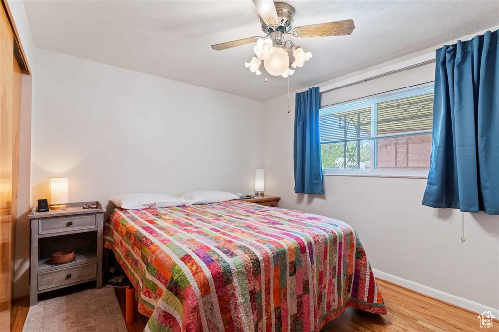 Bedroom featuring wood finished floors and ceiling fan