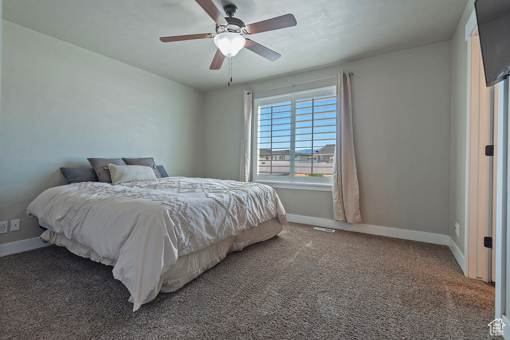Bedroom with carpet floors and ceiling fan