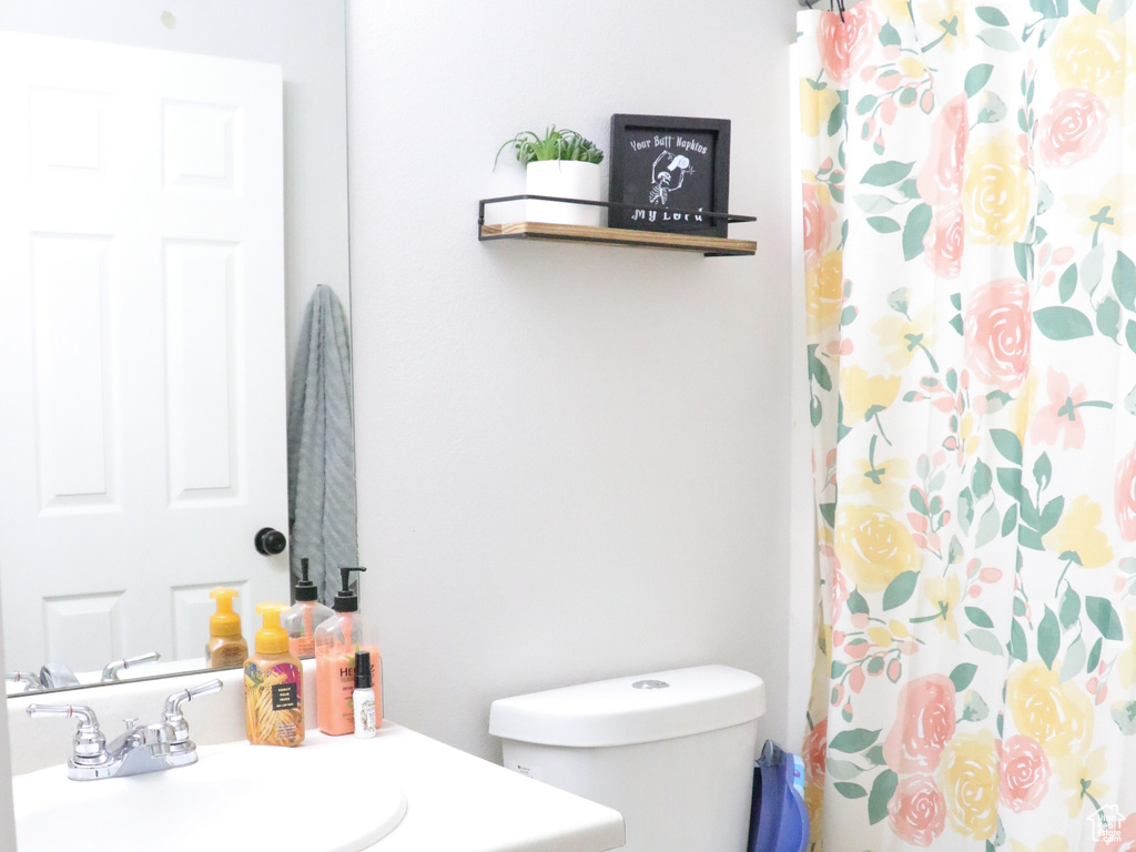 Bathroom with vanity, tile patterned floors, and a shower with curtain