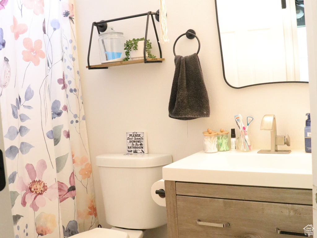 Full bathroom with vanity, a shower with shower curtain, and tile patterned floors