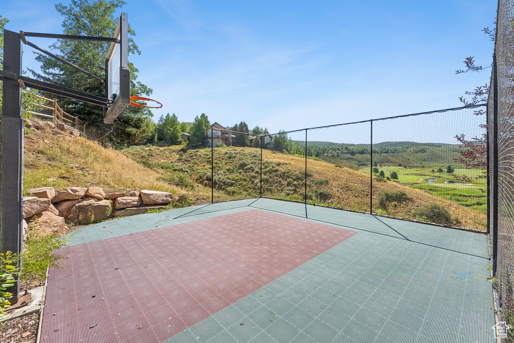 View of sport court featuring basketball court
