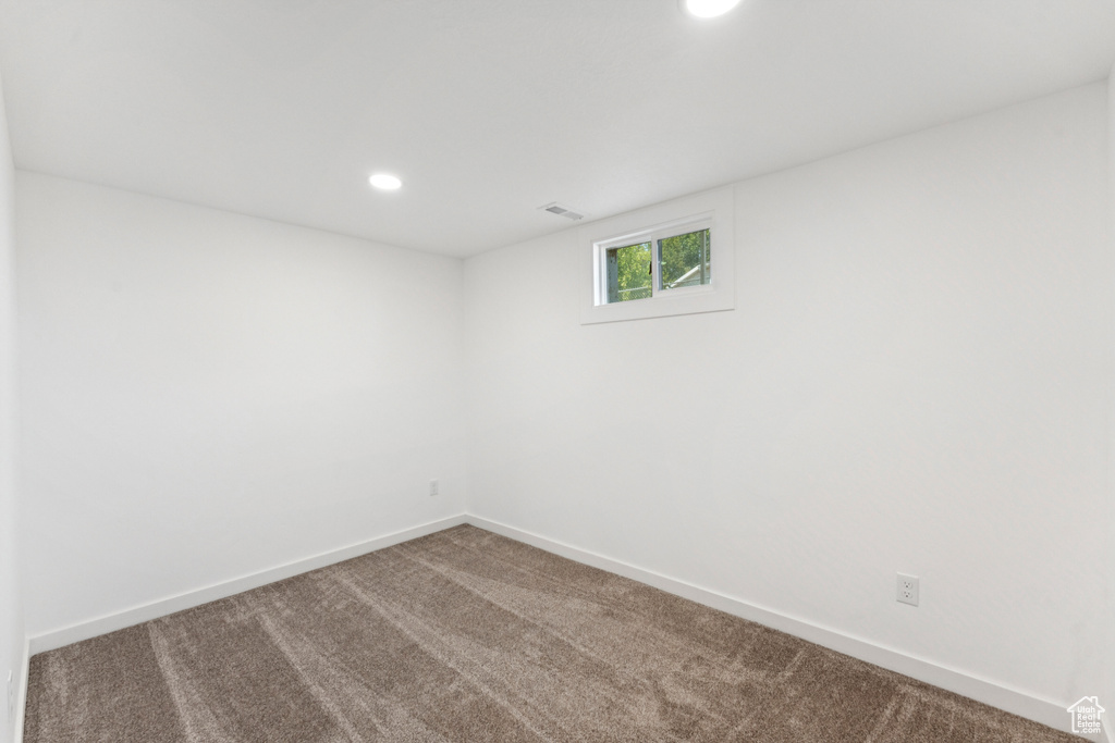 Spare room with carpet floors and recessed lighting