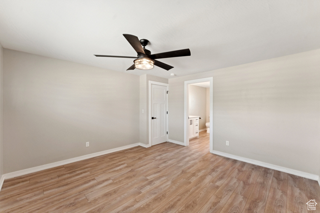 Spare room featuring ceiling fan and light wood-style flooring