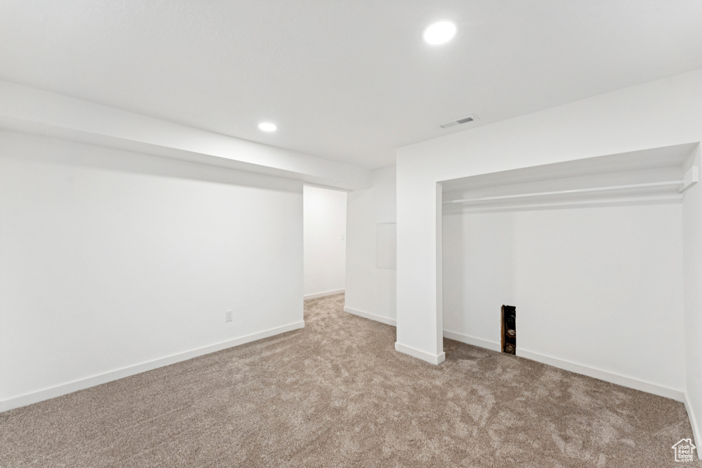 Finished basement featuring carpet flooring and recessed lighting