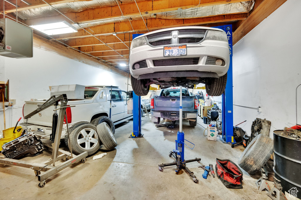 Garage featuring a heating unit