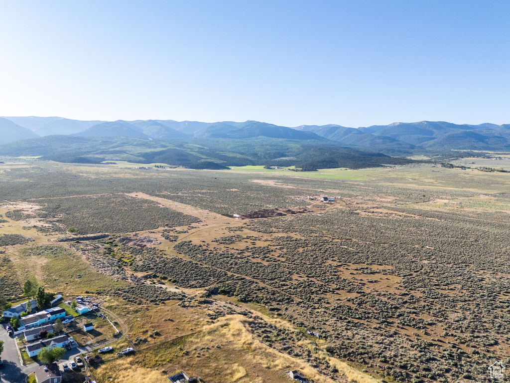 View of mountain backdrop with rural landscape