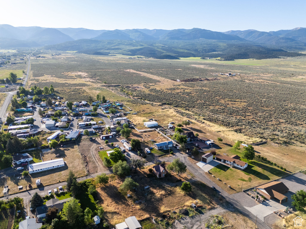 Aerial view of property\'s location with a mountain backdrop