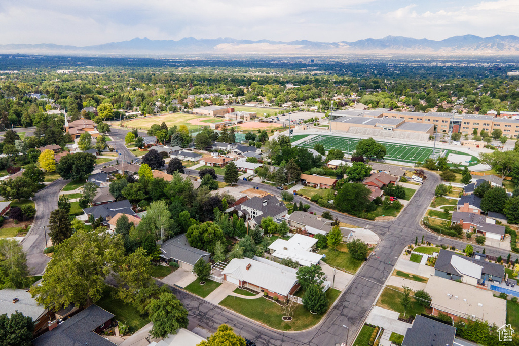 Aerial perspective of suburban area featuring a mountainous background