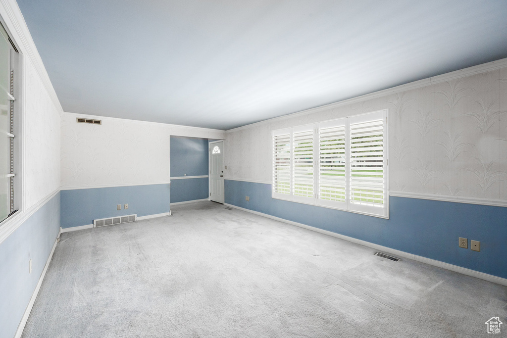 Empty room with carpet floors