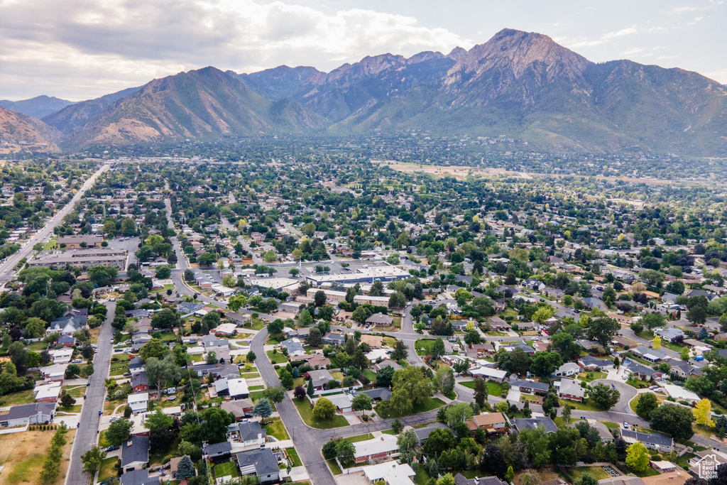 Aerial overview of property's location featuring a mountainous background