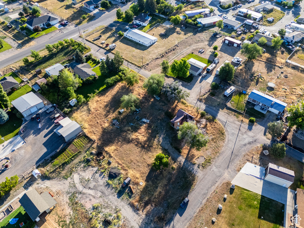 Aerial view of property\'s location with nearby suburban area