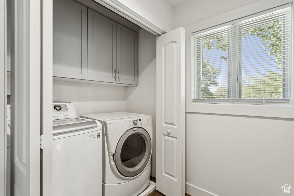 Laundry area with cabinet space and washer and dryer