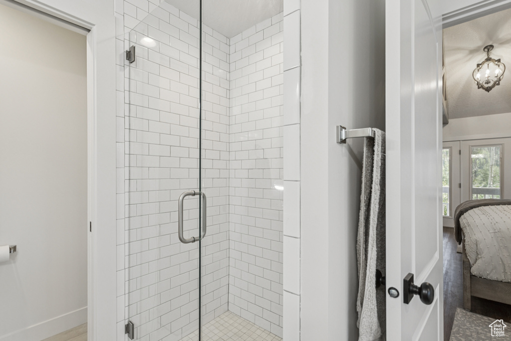 Ensuite bathroom featuring a shower stall