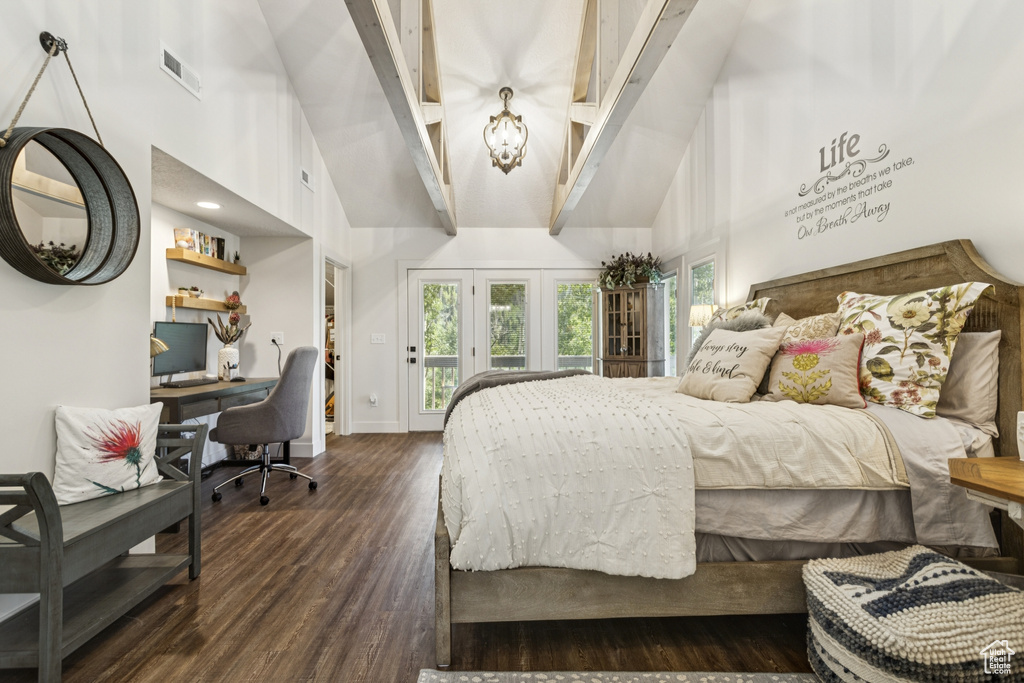 Bedroom featuring high vaulted ceiling, dark wood-style flooring, access to outside, and a desk