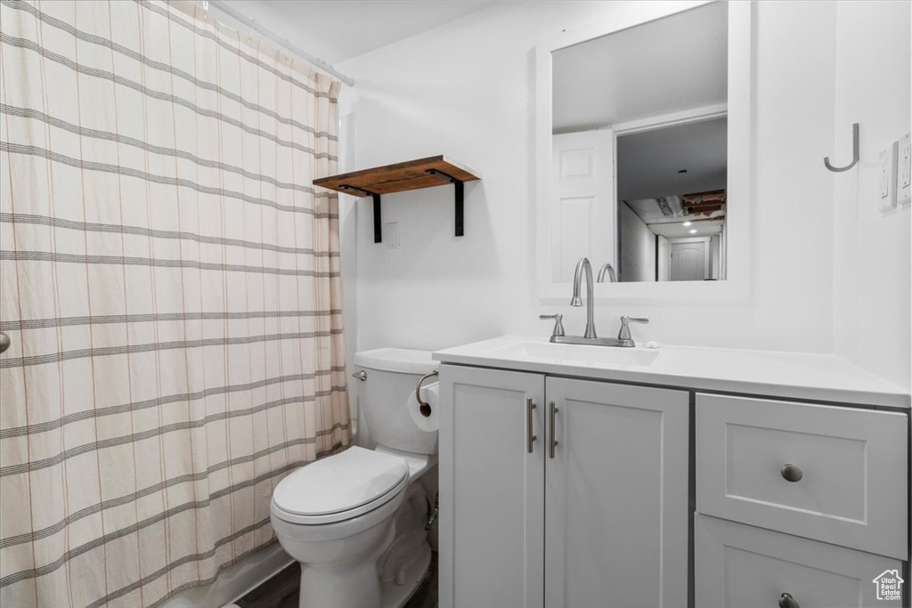 Full bathroom with vanity and a shower with curtain