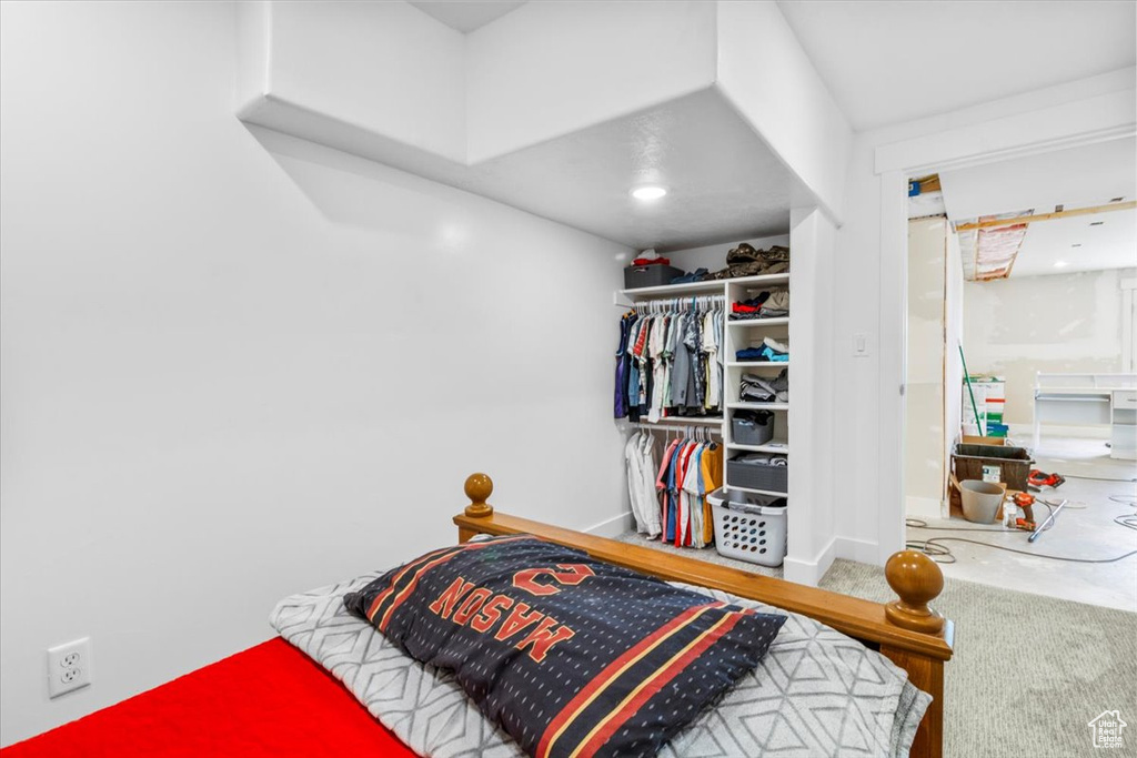 Bedroom with carpet and baseboards