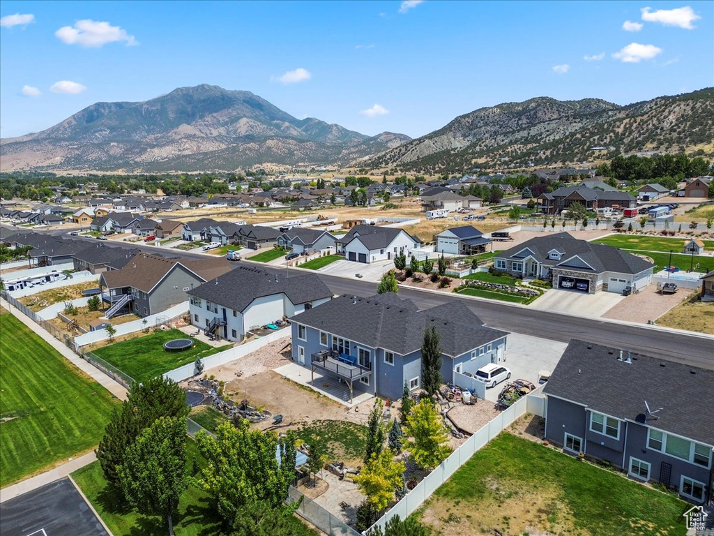Aerial view of residential area featuring a mountain backdrop