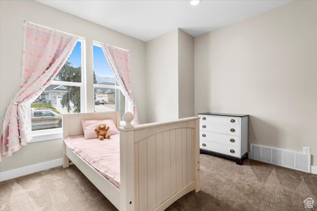 Bedroom with carpet and baseboards
