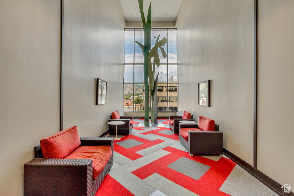 Lobby with expansive windows and a towering ceiling