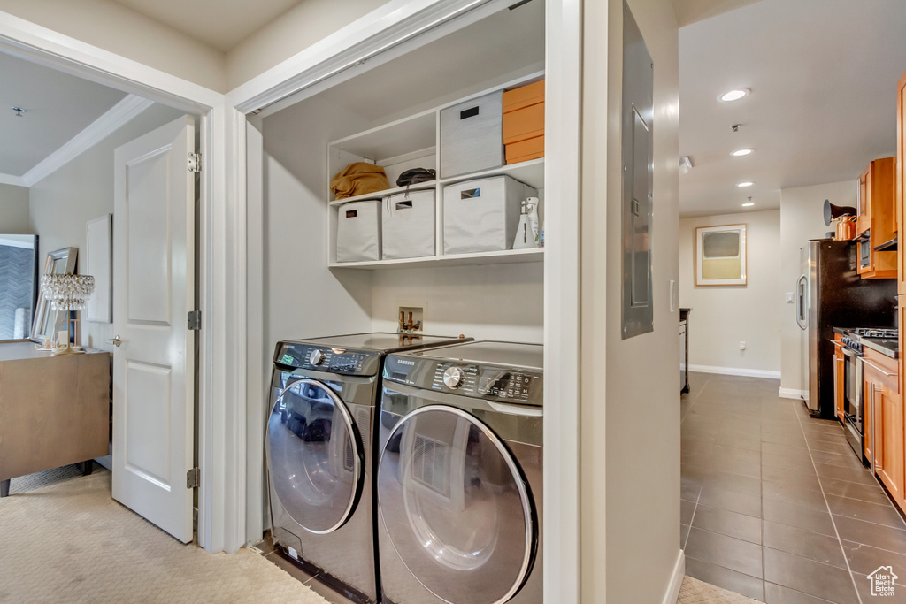 Laundry room with washer and dryer, recessed lighting, tile patterned flooring, and crown molding