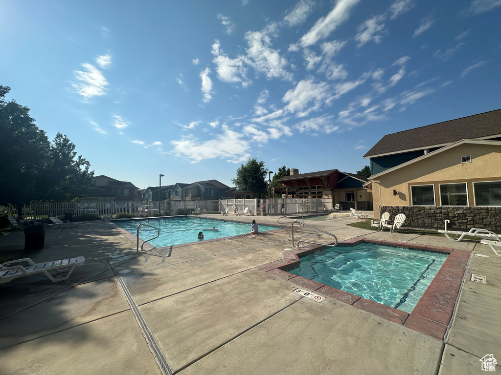 Community pool featuring a patio area