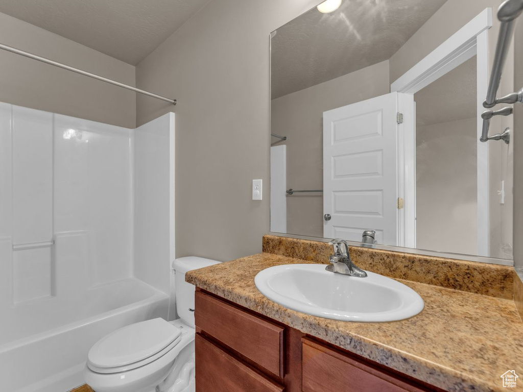 Bathroom featuring vanity and shower / bathtub combination