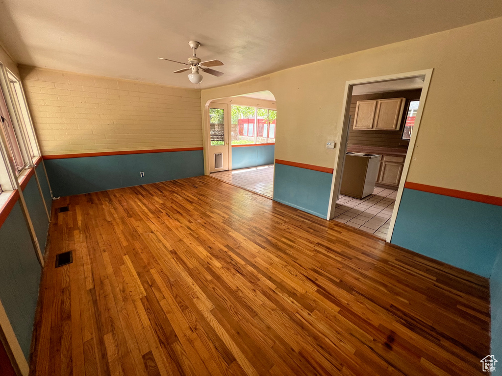 Spare room featuring ceiling fan and hardwood / wood-style flooring