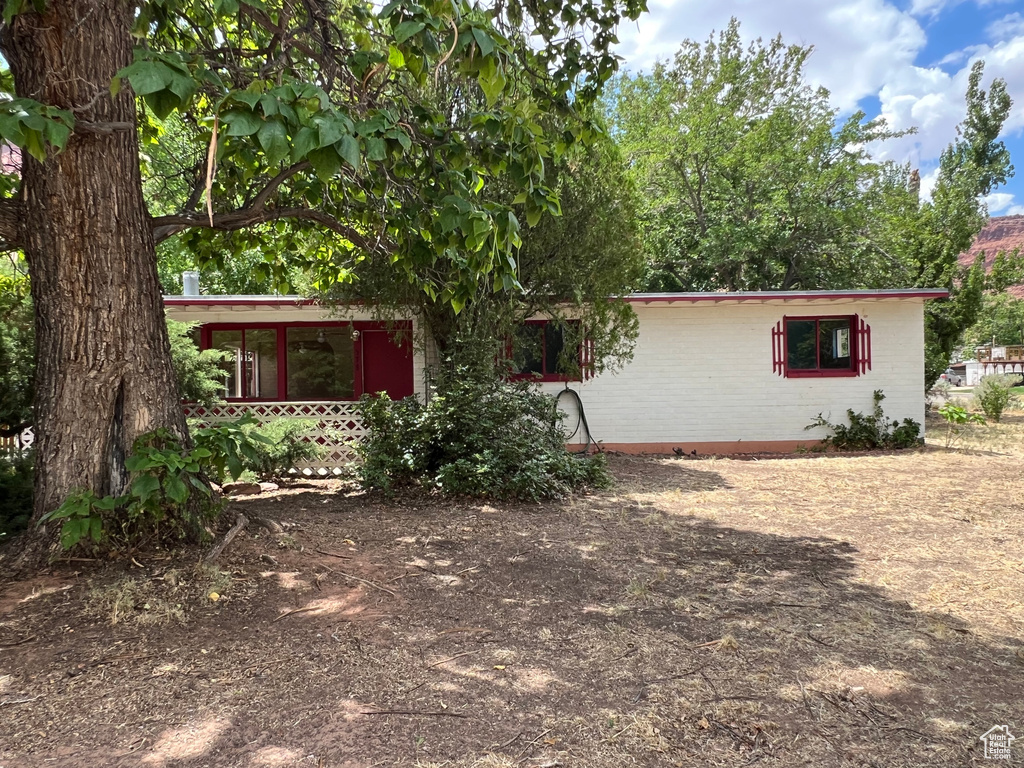 View of front of home featuring brick siding